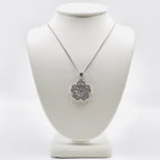 Genuine Sterling Silver flower necklace with clear cubic zirconia baguettes and round cubic zirconias