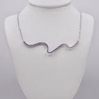 Genuine Sterling Silver Squiggle Line Necklace with clear, sky blue, and dark blue Cubic Zirconia
