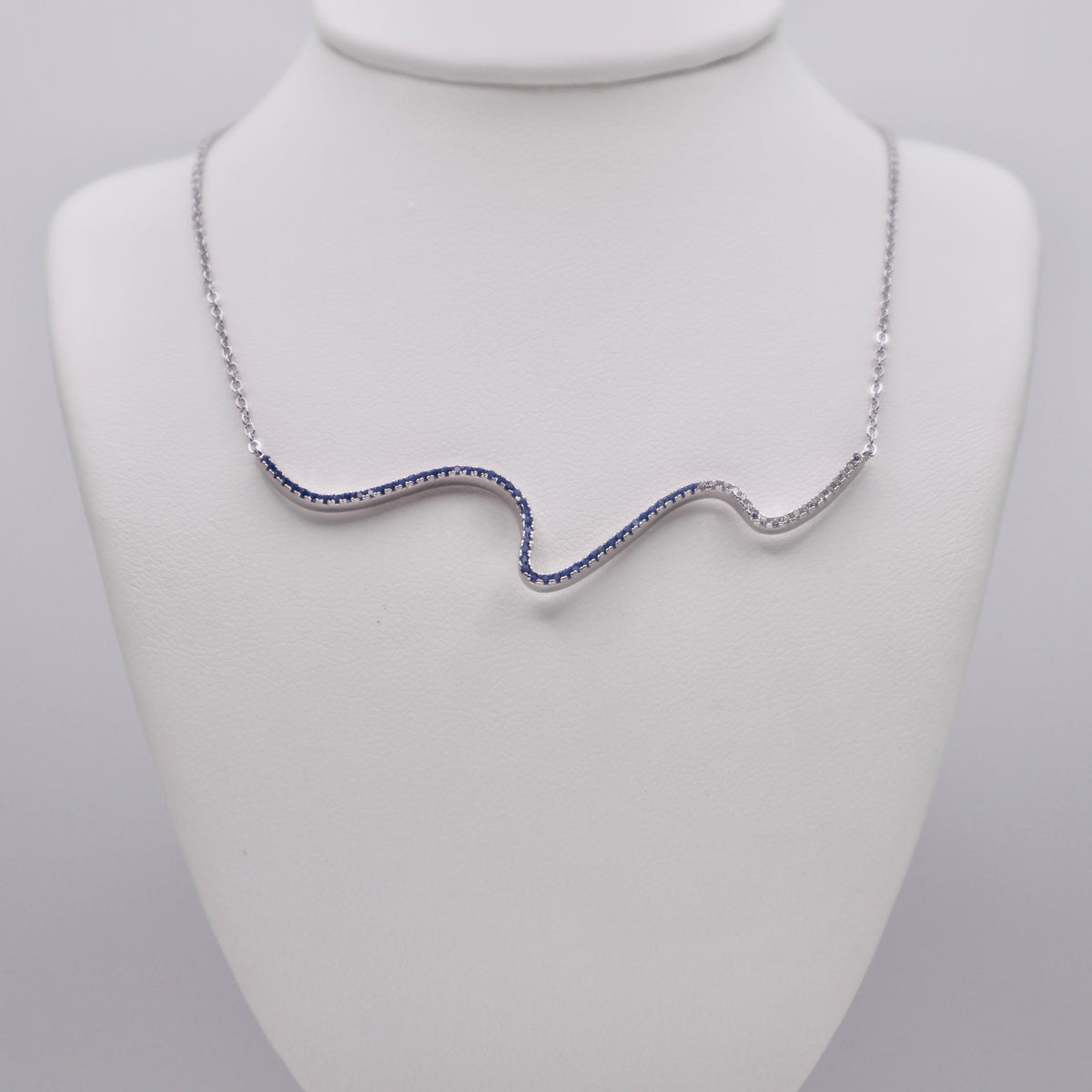 Genuine Sterling Silver Squiggle Line Necklace with clear, sky blue, and dark blue Cubic Zirconia